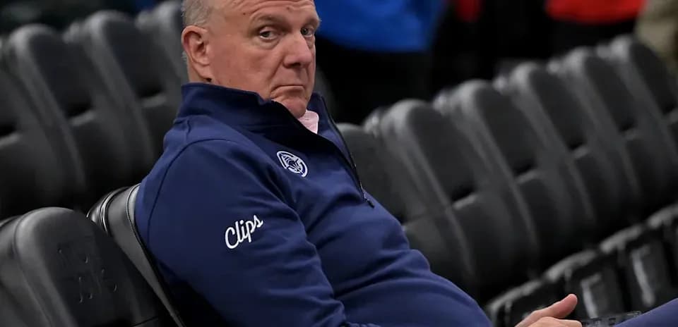 Man sitting alone in empty arena seats