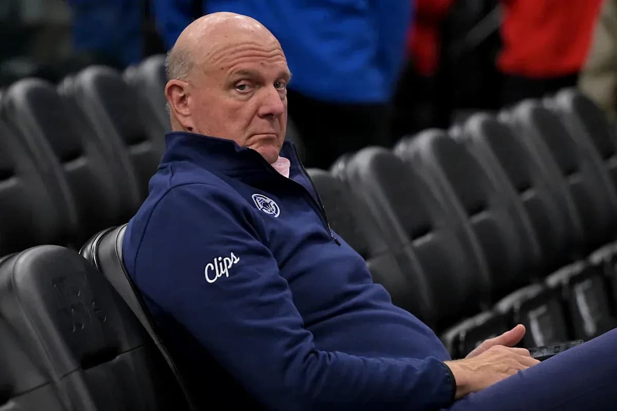 Man sitting alone in empty arena seats