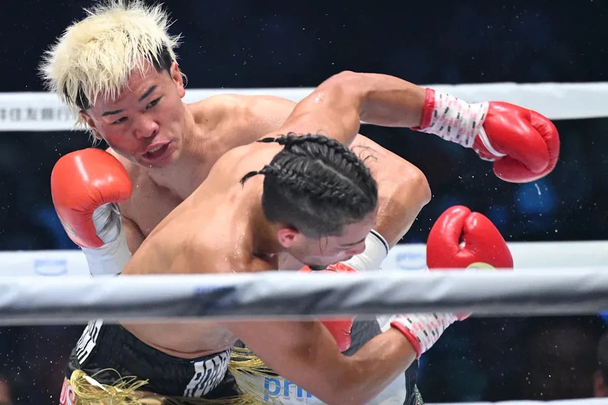 Boxer delivering a punch during a match