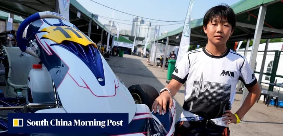 Young kart racer posing beside their kart