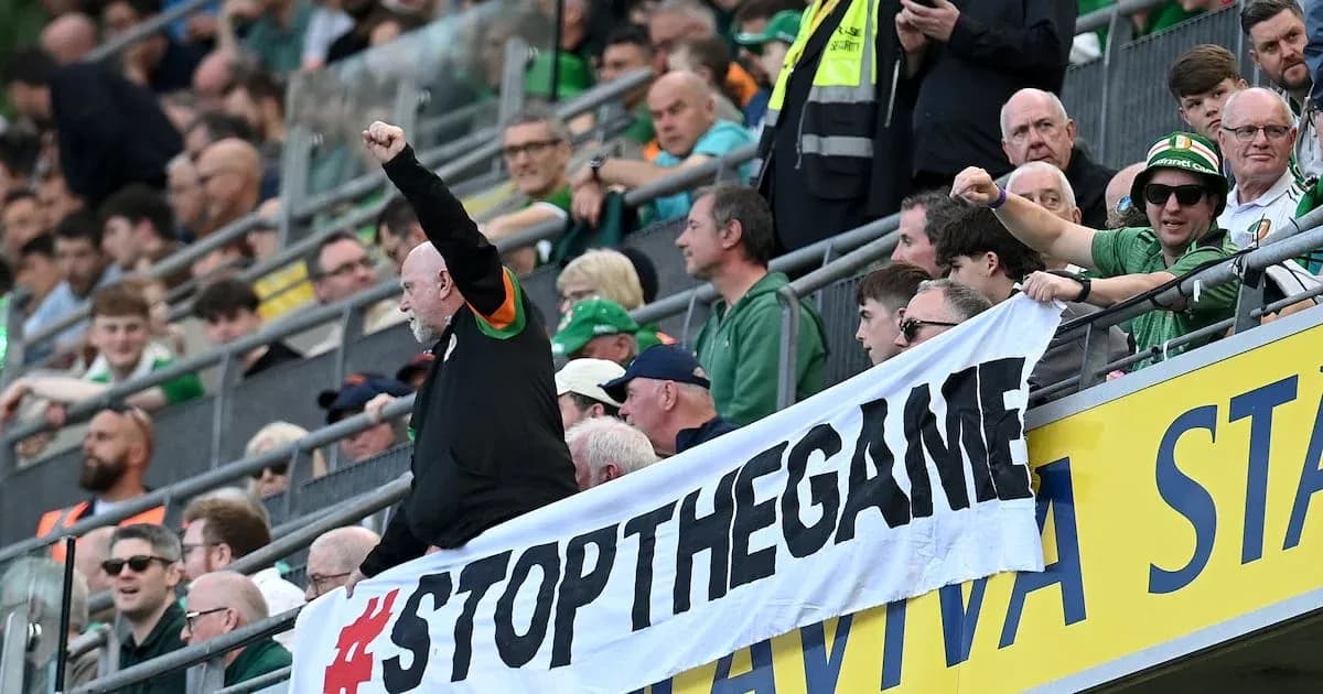 Fans holding a banner during a sports event