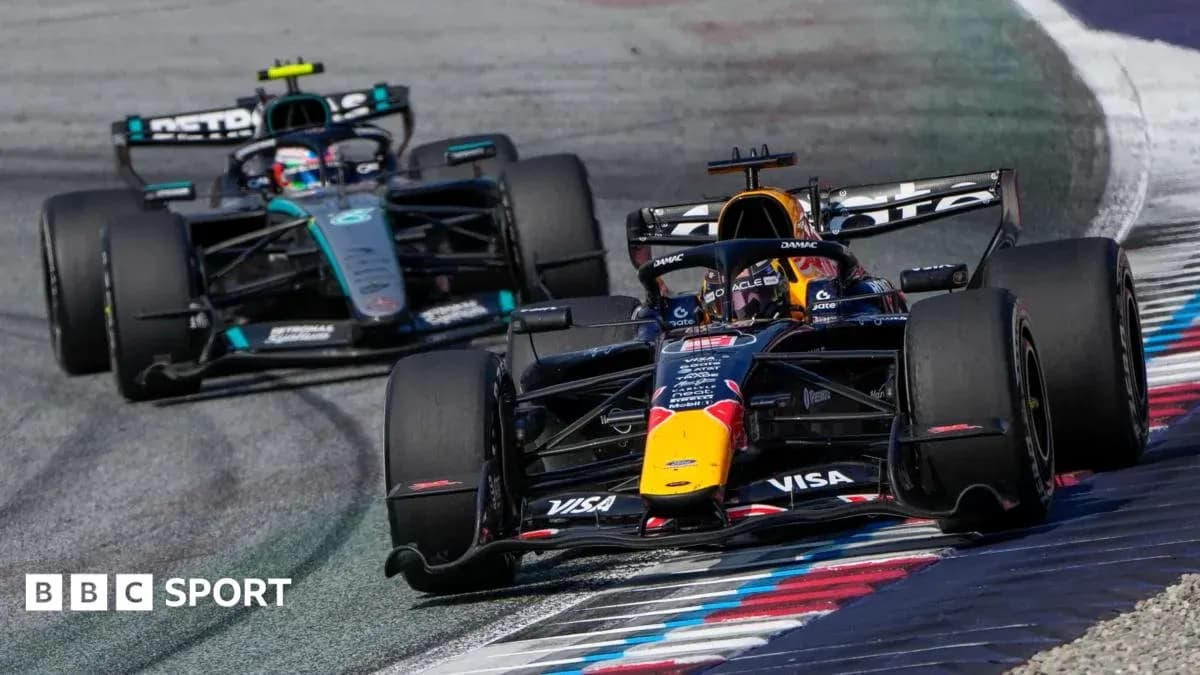 Two Formula 1 cars racing on track