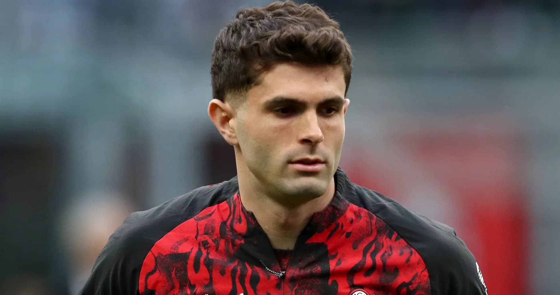 Player in red and black jersey on the field