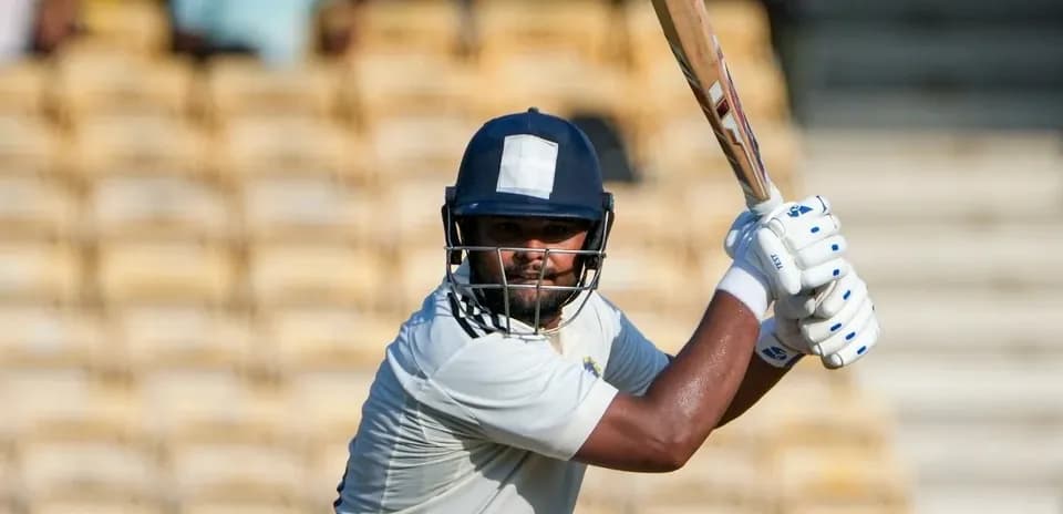 Batsman preparing to strike during cricket match
