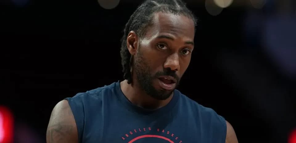 Basketball player in warm-up attire on court