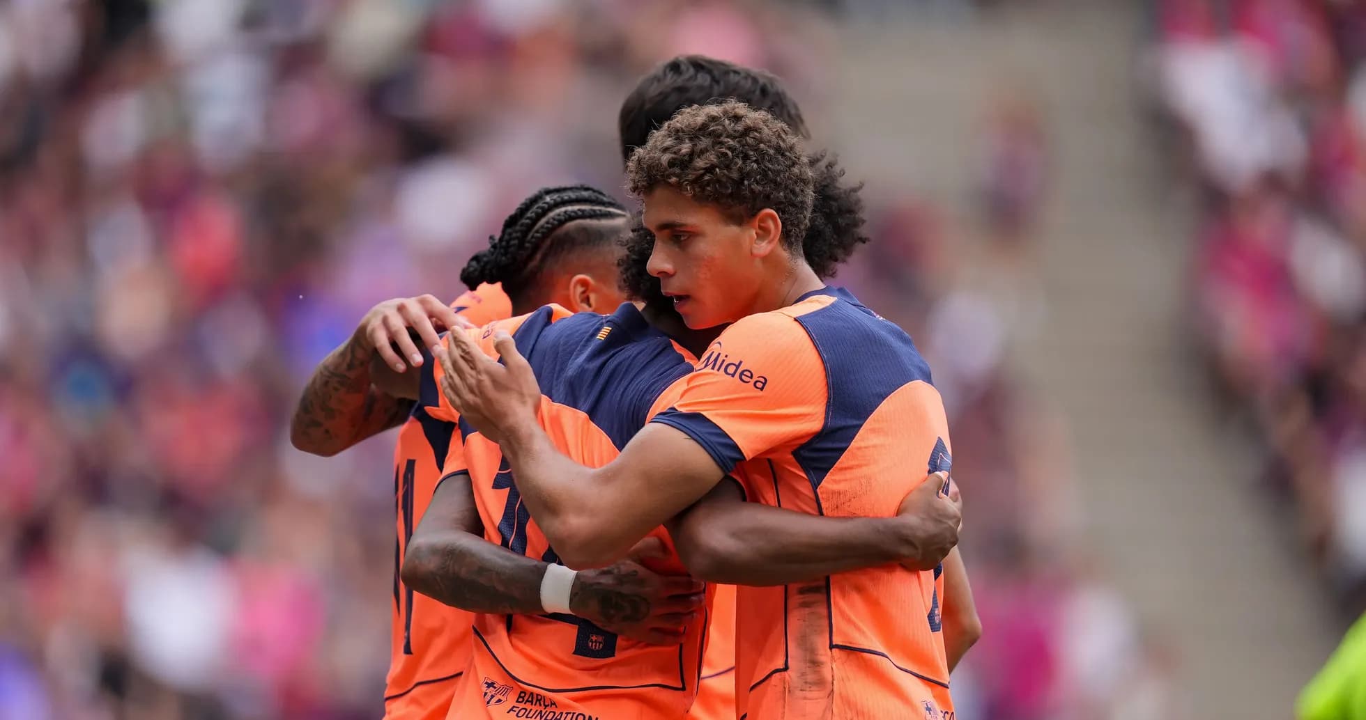 Players celebrating a goal during a match
