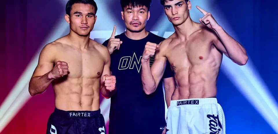Two fighters posing with a coach before match