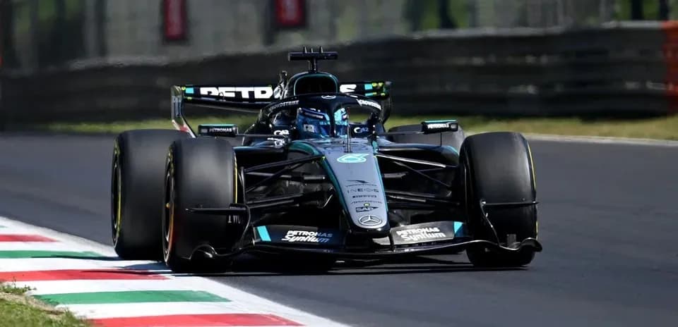 Formula 1 car racing on track with Italian flag colors