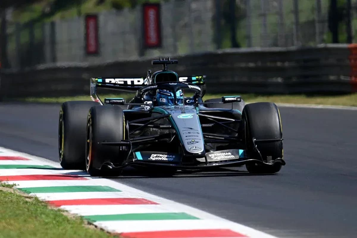 Formula 1 car racing on track with Italian flag colors