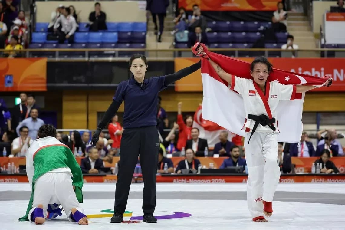 Athlete celebrating victory with flag after match
