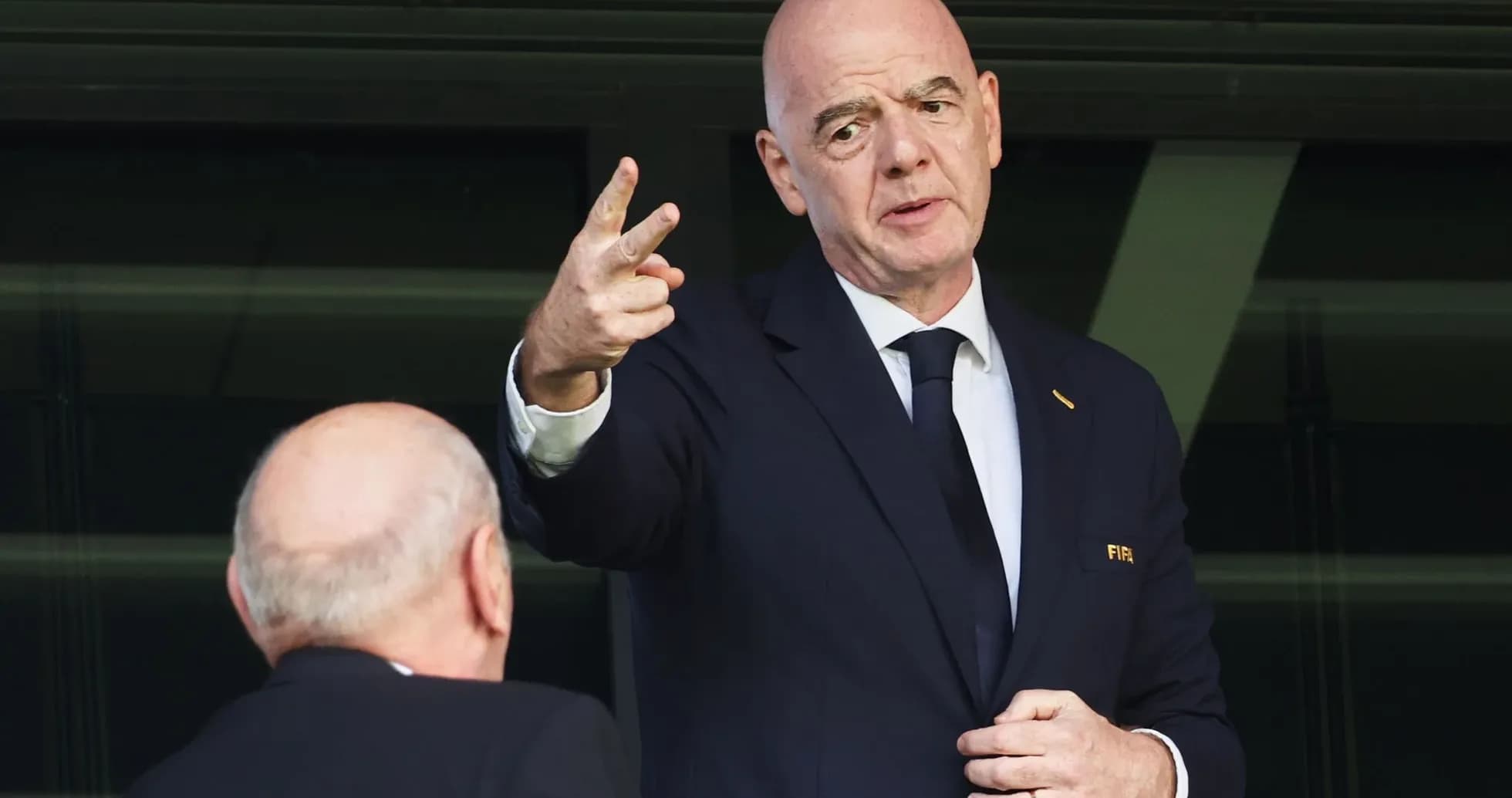 FIFA official speaking while gesturing with hand
