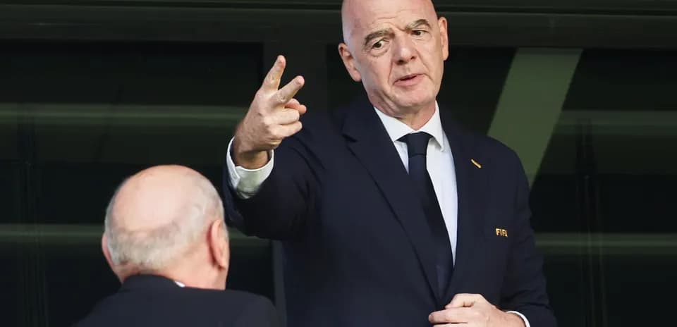 FIFA official speaking while gesturing with hand