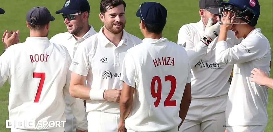 Cricket players celebrating a wicket on field