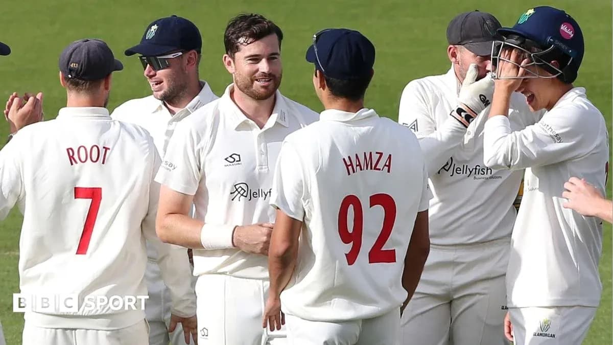 Cricket players celebrating a wicket on field
