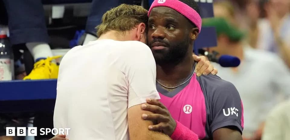 Two tennis players embracing after a match