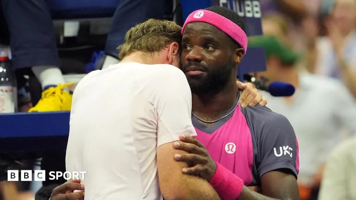 Two tennis players embracing after a match