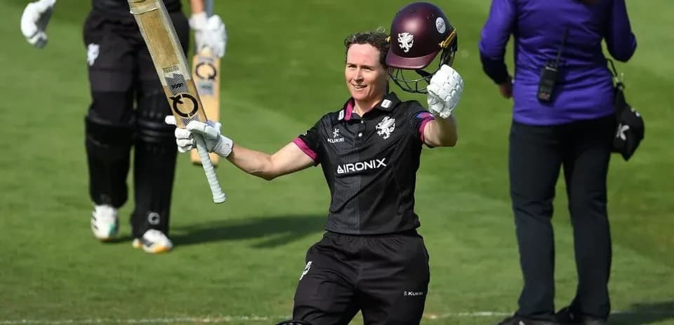 Batter celebrating after scoring a century on field