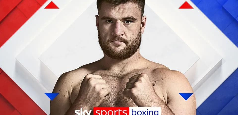 Boxer posing with fists raised for promotion