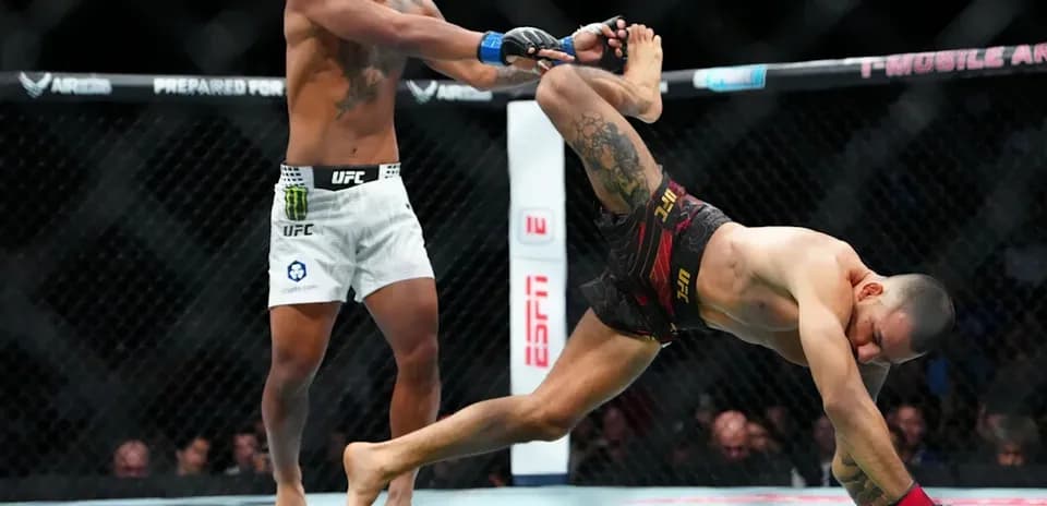 Fighter executing a takedown during UFC match