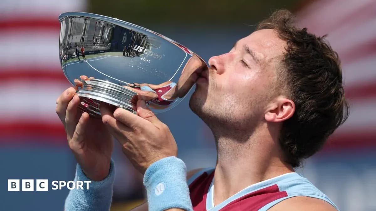Player kissing US Open trophy in celebration
