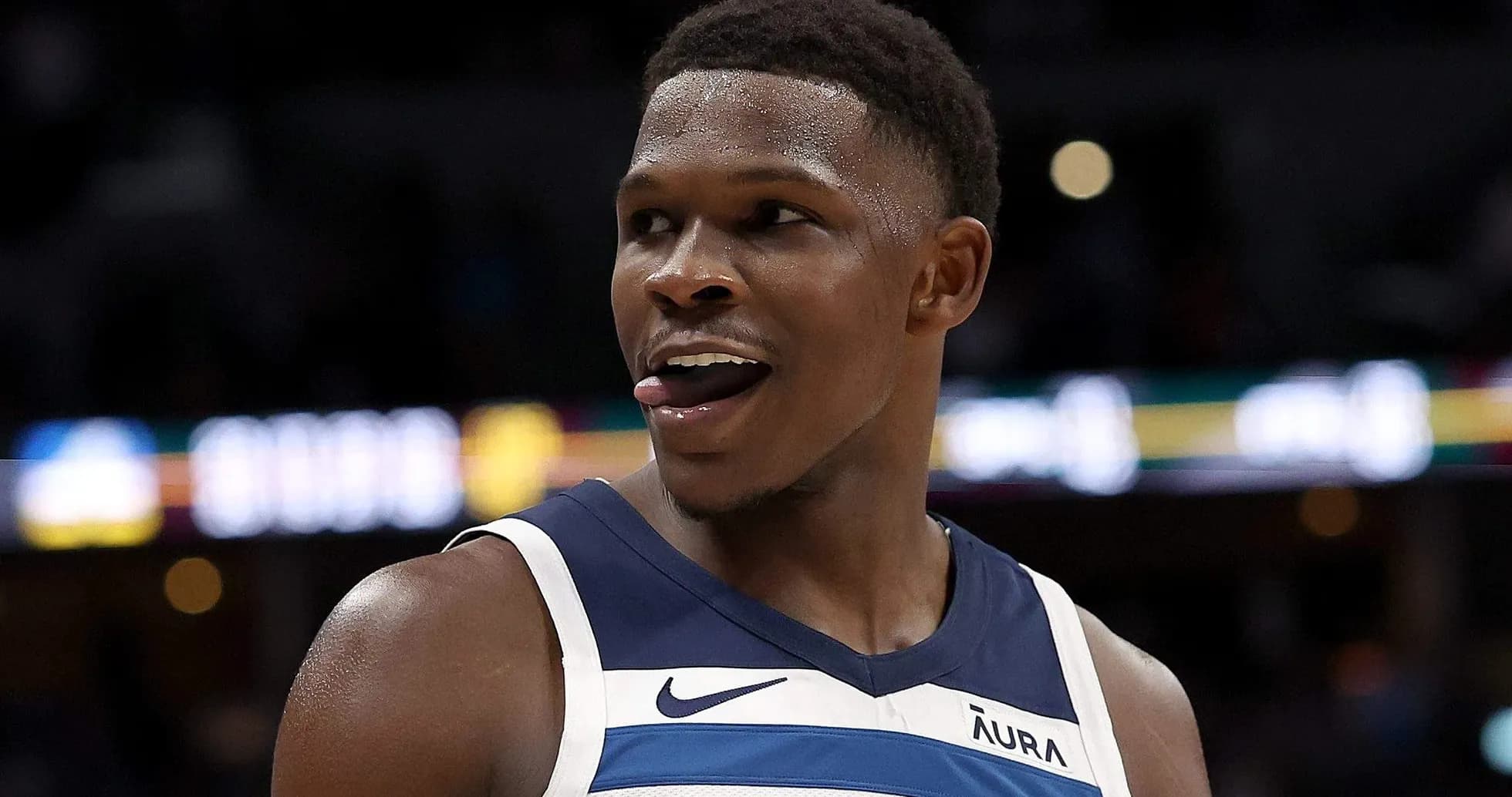 Player smiling and sticking out tongue during game
