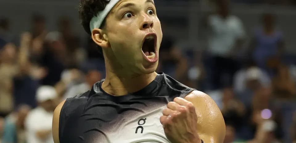 Tennis player celebrating a victory on court