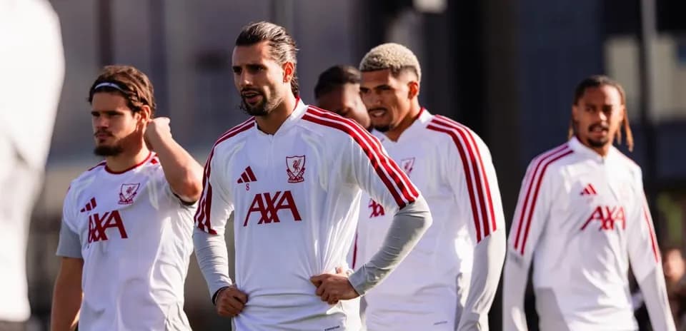 Players in Liverpool training kits during practice session