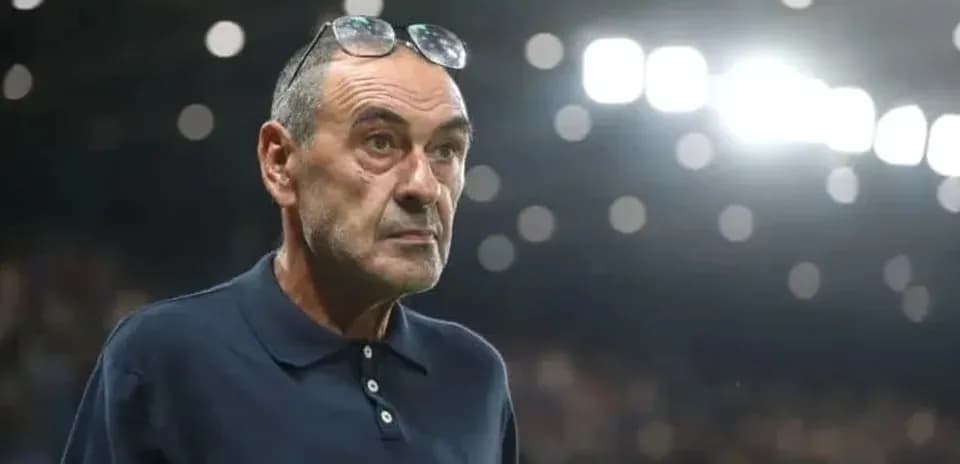 Coach observing match with glasses on his head