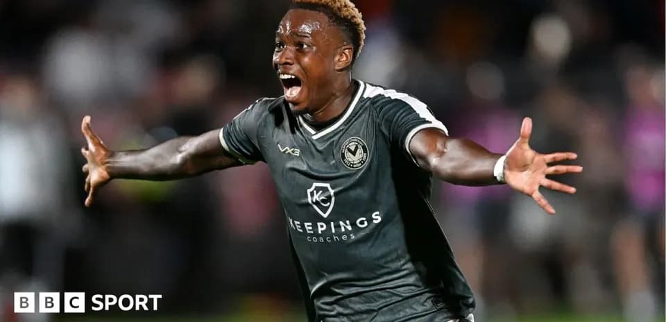 Player celebrating a goal on the pitch