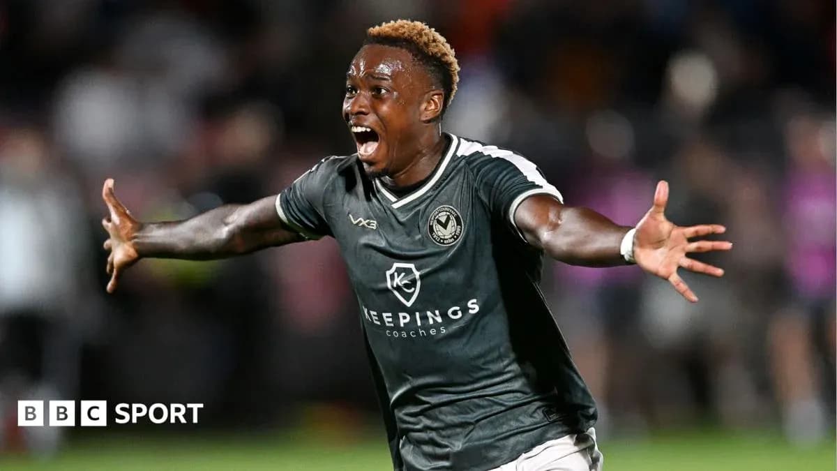 Player celebrating a goal on the pitch