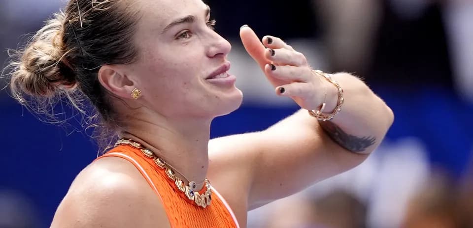 Tennis player celebrating after winning a match
