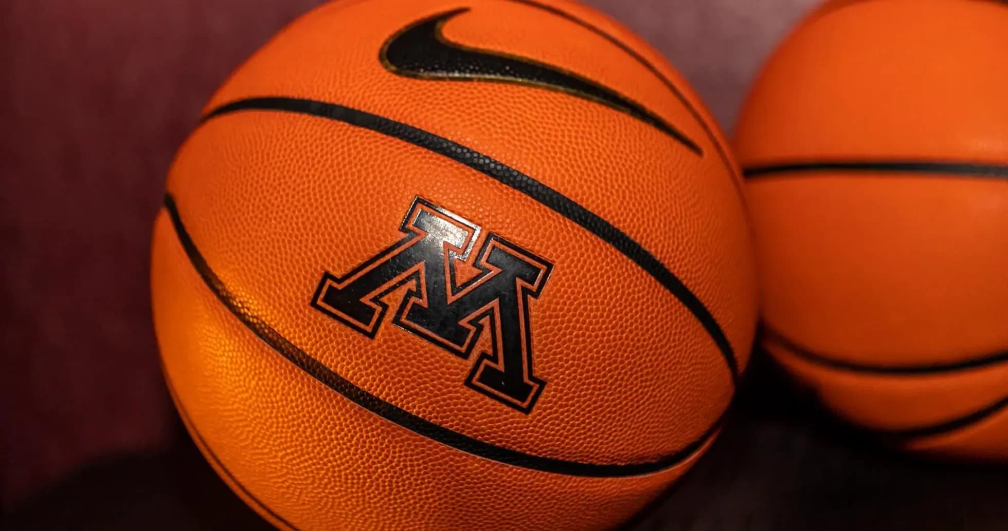 Two basketballs featuring the Minnesota logo