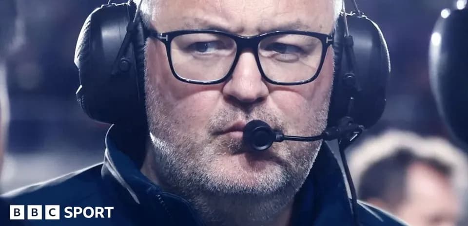 Coach wearing headset during a game