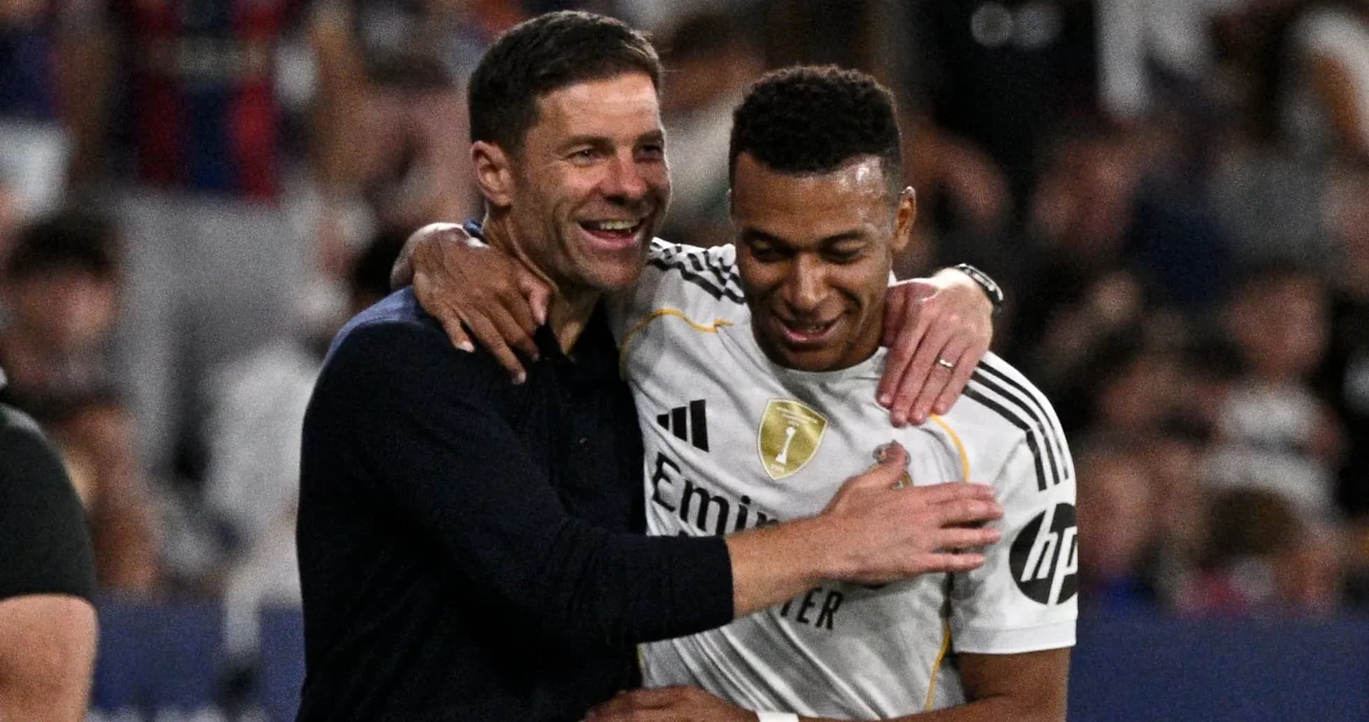 Coach and player celebrating after a match