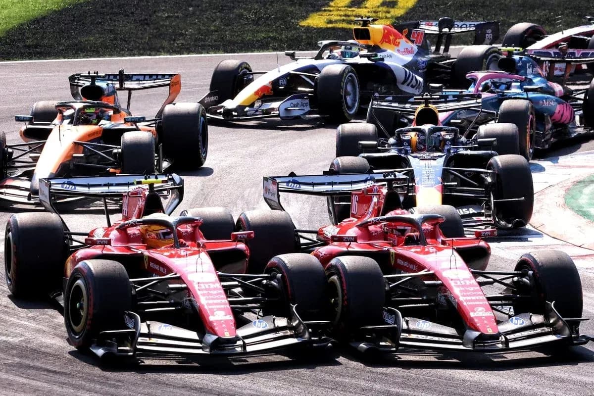 Formula 1 cars racing closely during a competition