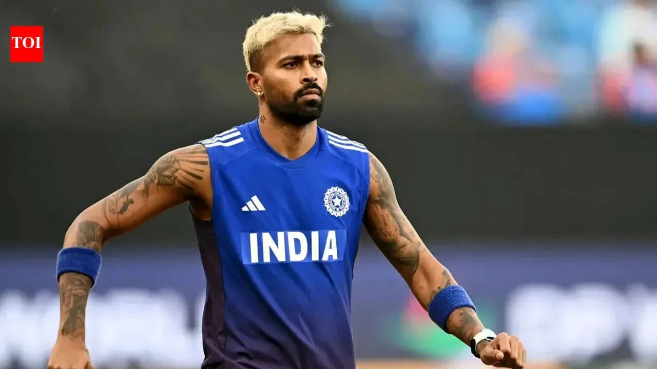 Cricketer warming up in blue India jersey
