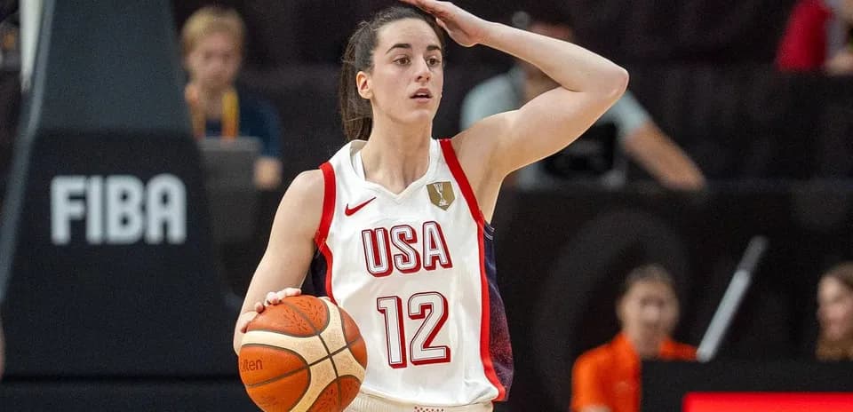 Player with ball gesturing during basketball game