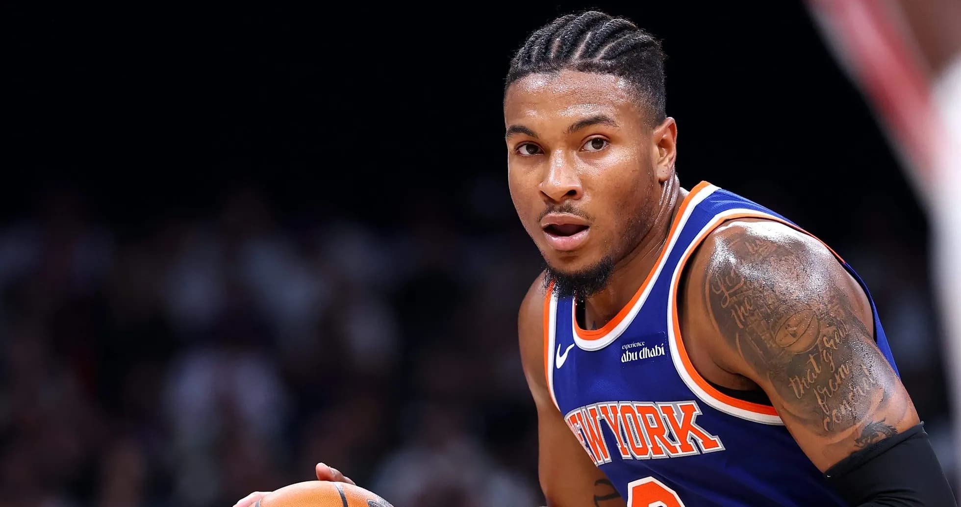 Player dribbling basketball during game action