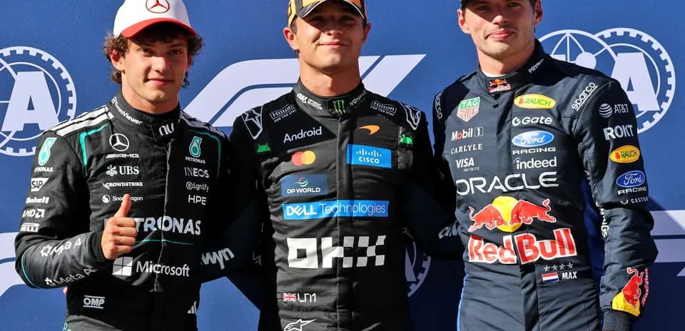 Three Formula 1 drivers posing for a photo