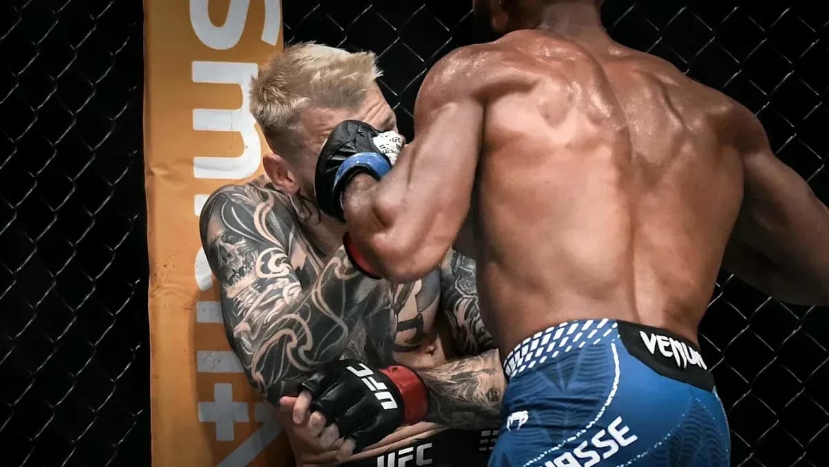 Two fighters exchanging blows in an MMA match