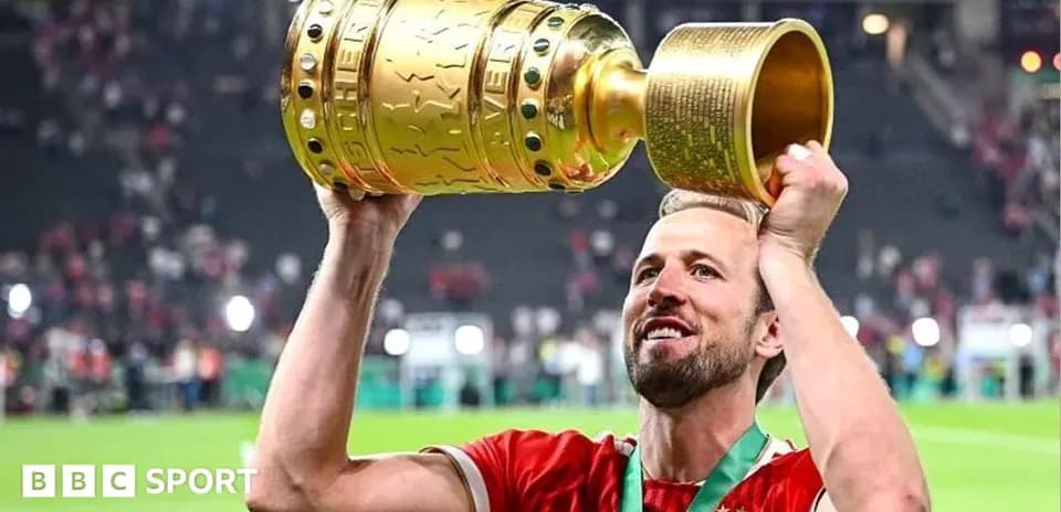 Player celebrating with trophy after winning match
