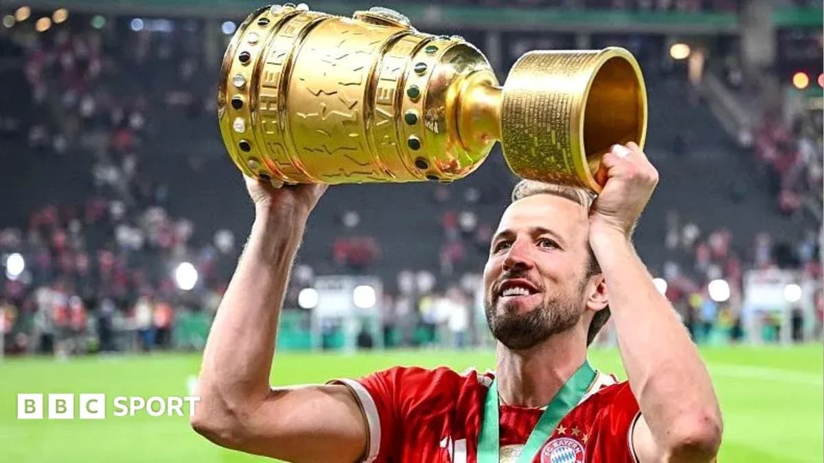 Player celebrating with trophy after winning match