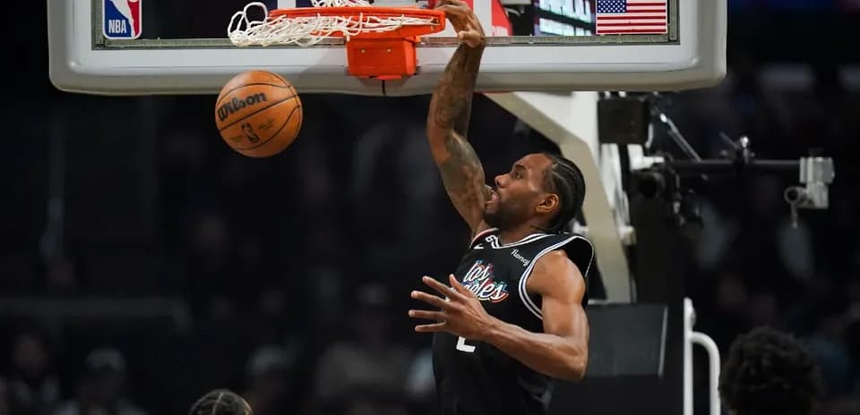 Player dunking a basketball during game action