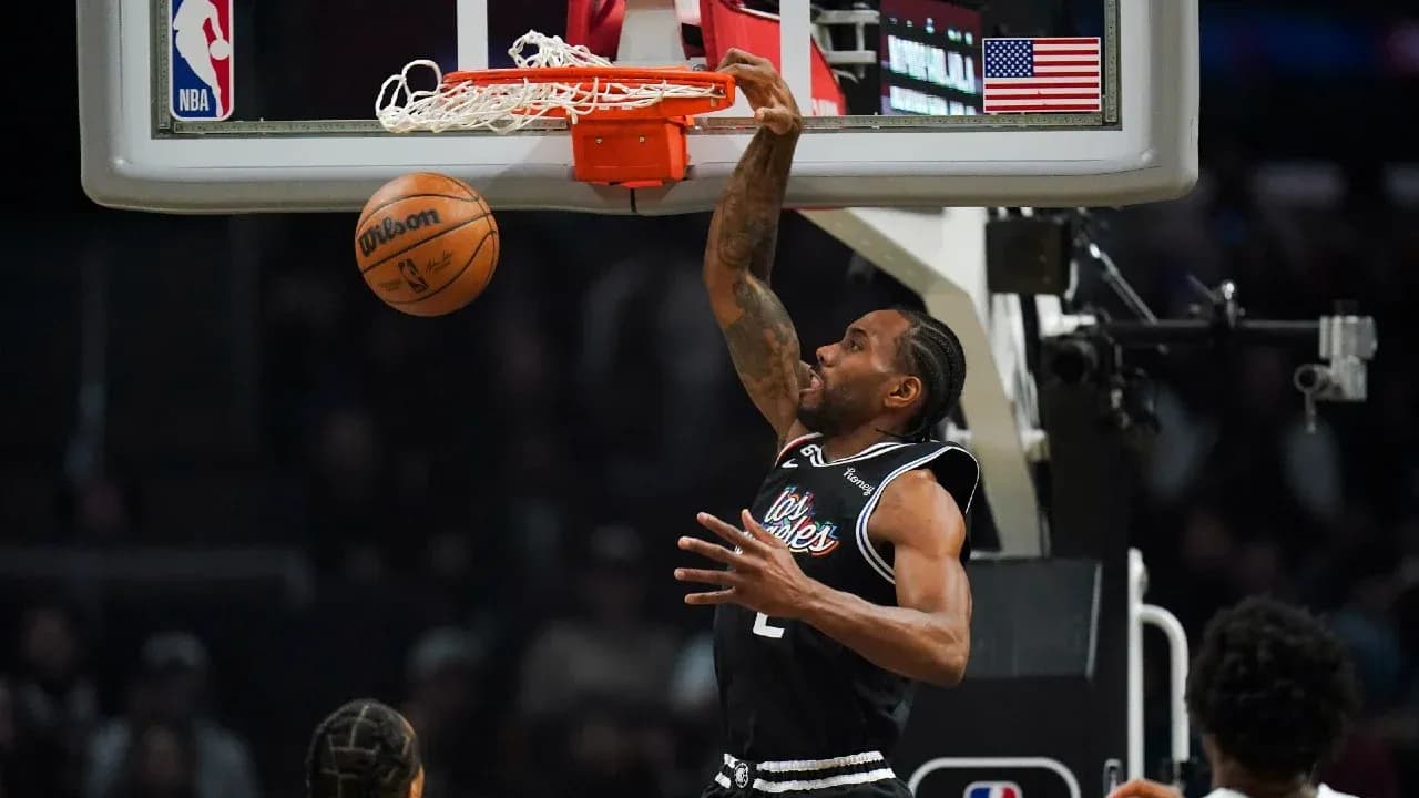 Player dunking a basketball during game action