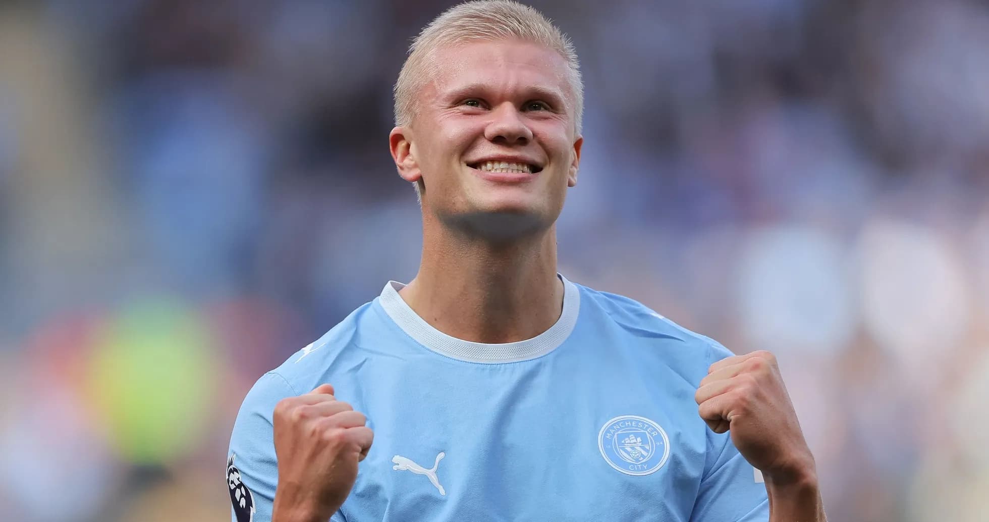 Player celebrating in Manchester City kit after match
