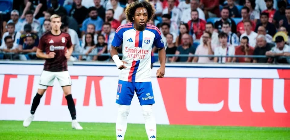 Player in OL kit during match with spectators
