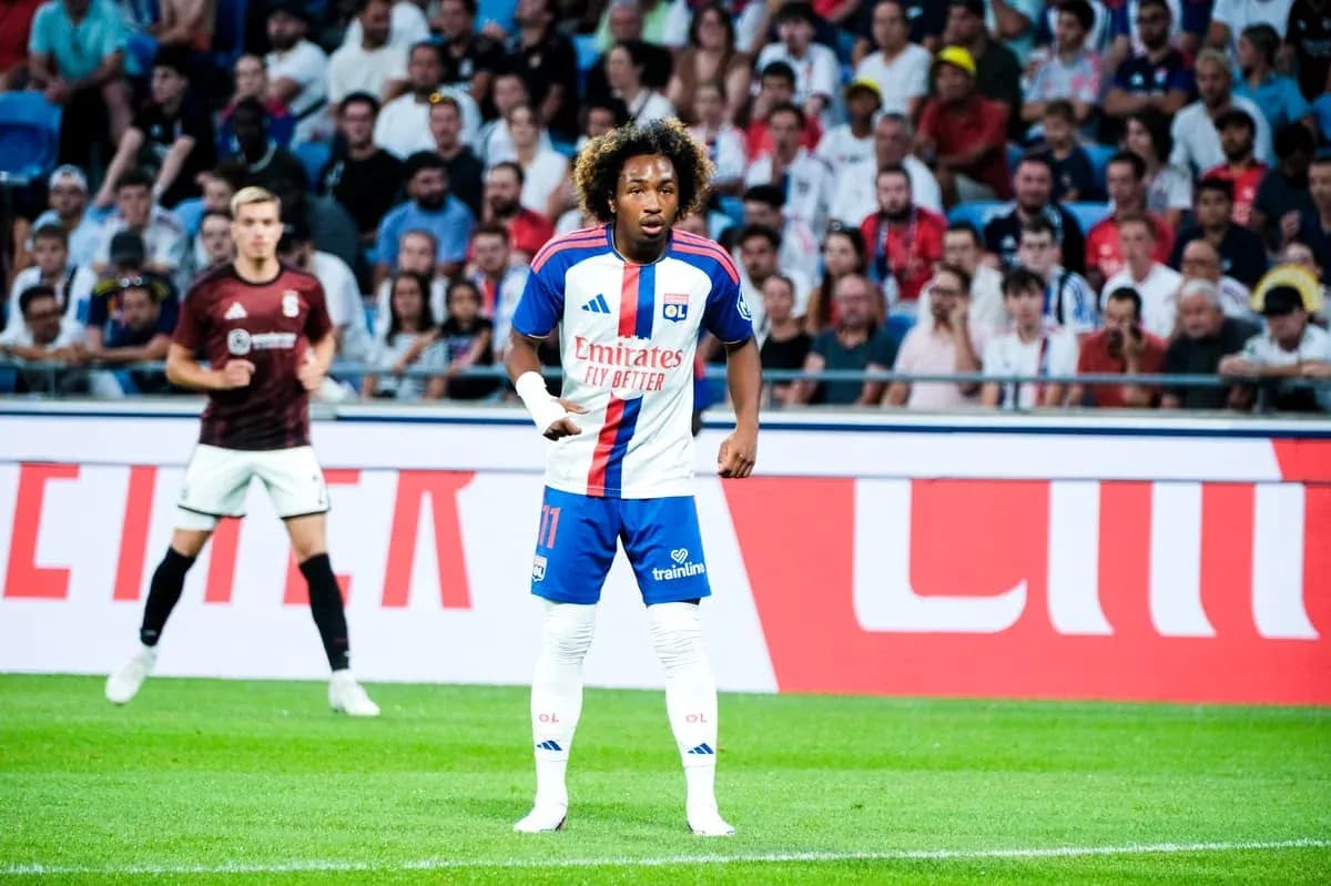 Player in OL kit during match with spectators