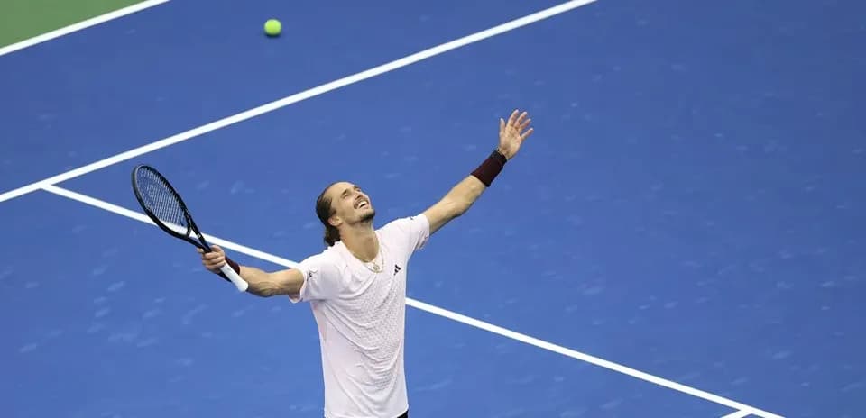 Player celebrating after winning a point in tennis match
