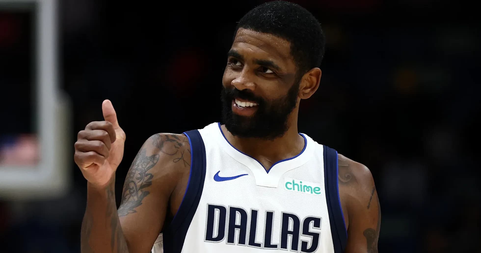 Player in Dallas Mavericks jersey giving thumbs up