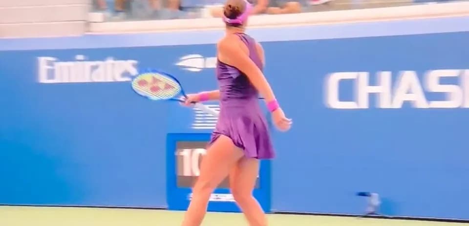 Tennis player preparing to hit a backhand shot